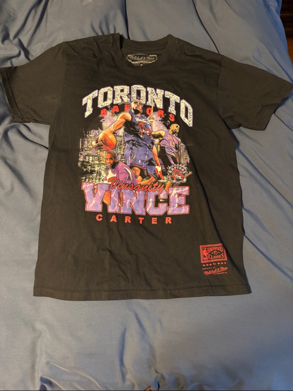 Mitchell & Ness Black Tee with Purple and Red Lettering